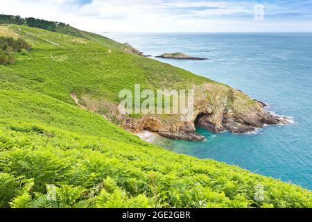 Herm, Channel Islands, UK - June 30, 2016: panoramic view from the cliff walking path on the south eastern shore of the island. Stock Photo