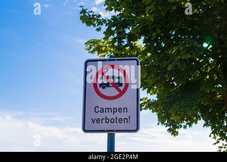 A sign with the German inscription Camping prohibited Stock Photo