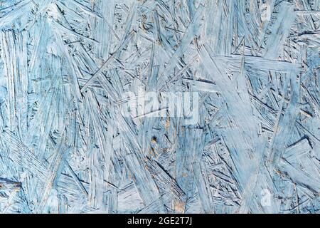 Natural plywood surface wood texture. Dark wooden material. OSB oriented chipboard texture. Stock Photo