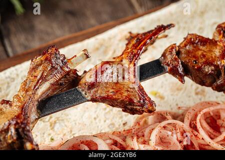 Grilled georgian lamb ribs shashlik skewers Stock Photo