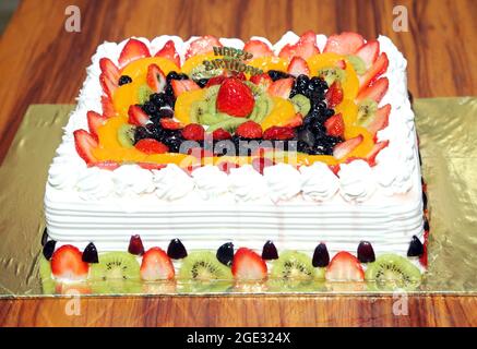 Delicious Creamy Fruit Cake. Birthday Wishing Beautiful Fruit Cake. Stock Photo