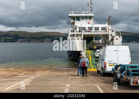 Vehicles and foot passengers boarding the Cal-Mac ro-ro ferry the MV Loch Shira on the Cumbrae Slip with Largs, the desination of the short journey, i Stock Photo