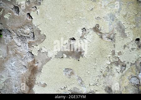 Old concrete wall with peeling plaster Stock Photo