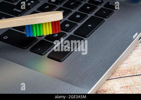 Closeup to colorful of Toothbrush wooden handle Cleaning  the keyboard. Stock Photo