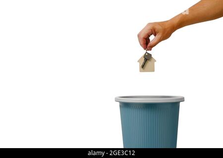 Keys to house and apartment are thrown into trash.Expensive and budget housing mortgage and on credit. Stock Photo