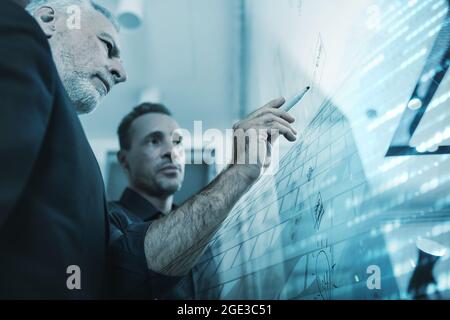 Business man exhibits a project to his boss Stock Photo