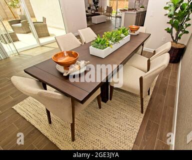 Dining Area With Long Table And Six High Back Chairs Stock Photo