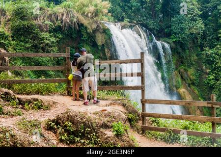 PULHAPANZAK, HONDURAS - APRIL 18, 2016 Tourists observe Pulhapanzak waterfall Stock Photo