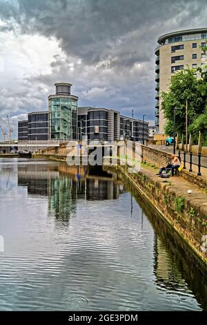 UK, West Yorkshire, Royal Armouries Museum in Leeds Dock and Riverside Apartments Stock Photo