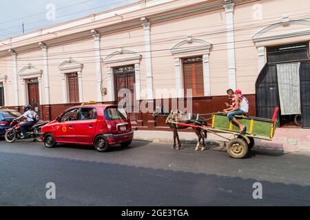 LEON, NICARAGUA - APRIL 25, 2016: Horse carriage on a street in the center of Leon, Nicaragua Stock Photo