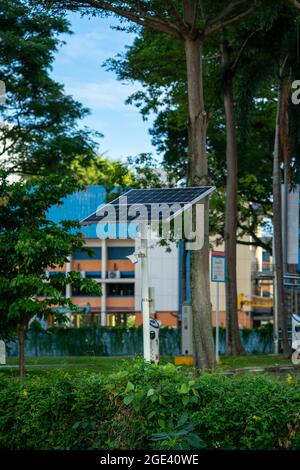 Security cctv camera powered by solar panel, Singapore Stock Photo