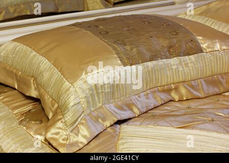 Gold pillow. Luxury bedding Stock Photo