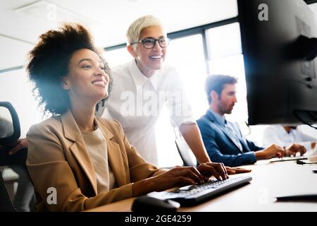 Portrait of successful business team working in office Stock Photo