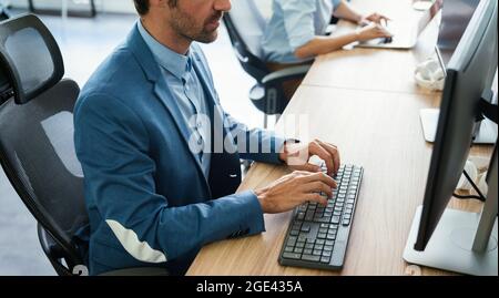 Software engineers working on project and programming in company Stock Photo