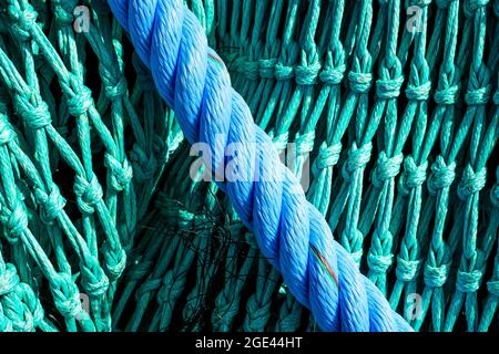 Normandy, France. Colorful fishing net drying on pier after