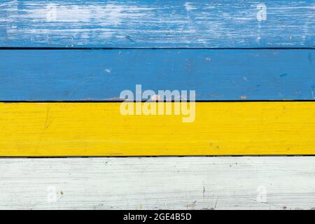 Abstract background of colored in blue, yellow and white paint old and grunge wooden planks with copy space Stock Photo