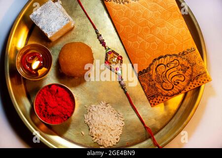 Close-up Rakhi kept in a decorative thali on the occasion of Rakshabandhan Stock Photo