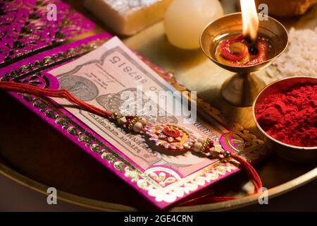 Close-up Rakhi kept in a decorative thali on the occasion of Rakshabandhan Stock Photo