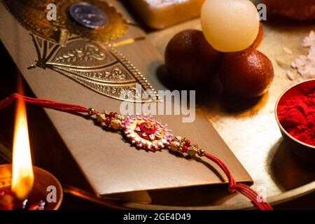 Close-up Rakhi kept in a decorative thali on the occasion of Rakshabandhan Stock Photo