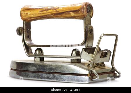 vitage electric flatiron with wooden handle isolated on white background Stock Photo
