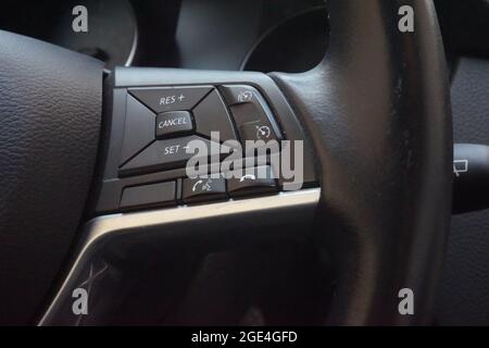 Modern steering wheel with multi-function buttons for quick control,Close up interior modern Black interior Comfortable Car. Stock Photo