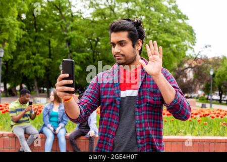 Student having online call with his family Stock Photo