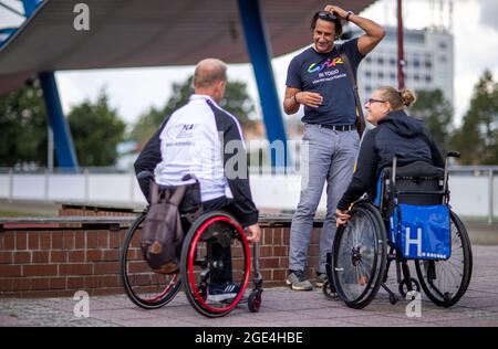 Rostock, Germany. 11th Aug, 2021. Christian Schenk, decathlon Olympic champion from Seoul 1988, meets with Hanna Wichmann and Raimund Spicher from the 1.LV Rostock in the athletics stadium as state coach of the para-athletes in Mecklenburg-Vorpommern. Credit: Jens Büttner/dpa-Zentralbild/dpa/Alamy Live News Stock Photo