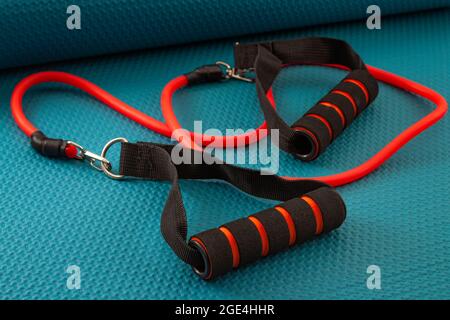 Home gym and strength training concept with rubber resistance bands on yoga mat Stock Photo