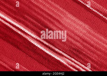 Texture of Gradient Red Striped Alpaca Knitted Wool Fabric in Diagonal Patterns for Abstract Background Stock Photo