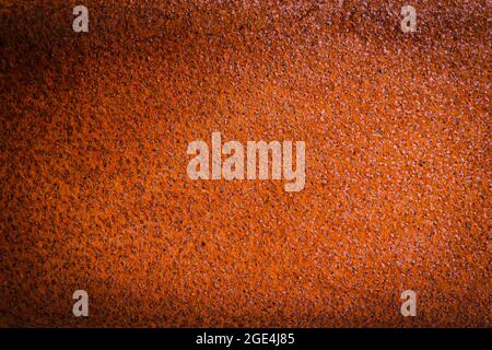 Rusty metal background in orange with strong vignette Stock Photo