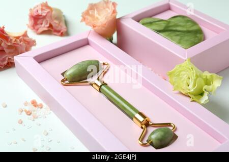 Skin care concept with face roller and gua sha on white background Stock Photo