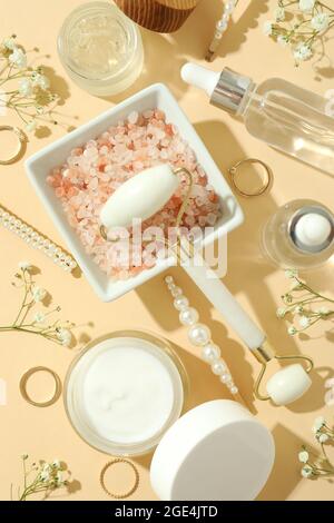 Skin care beauty concept with face roller on beige background Stock Photo
