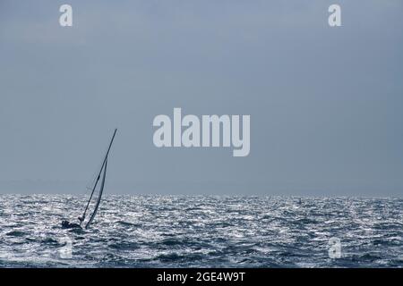 Sailing in the Solent just off the Needles off the coast of the Isle of Wight Stock Photo