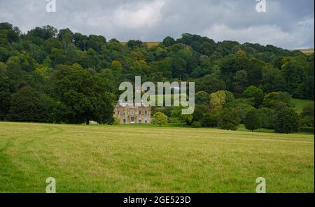 Rainscombe House, Oare Wiltshire. A 19th Century grade II listed country estate property with parkland and grounds Stock Photo