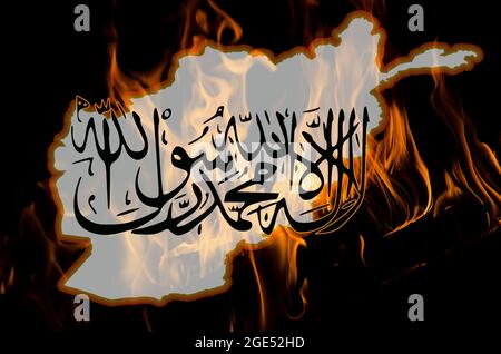 Afghanistan outline map and Taliban insignia with burning fire background. Afghanistan problem concept. Stock Photo