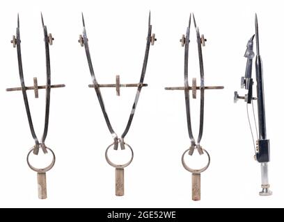 Compass for drawing technical drawings. Accessories for drawing geometric shapes. Isolated background. Stock Photo