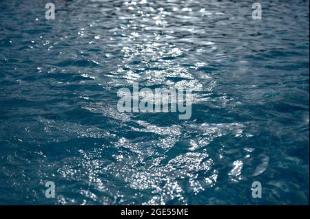 detail of the reflection of sunlight on the water in a swimming pool Stock Photo