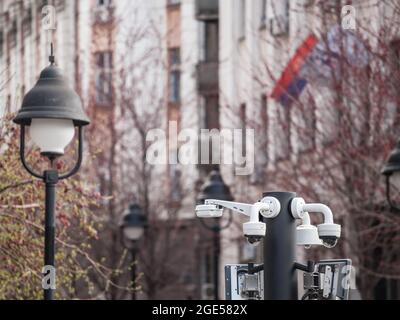 Picture of  dome cameras, safety cctv cameras, on display in a city center of Europe with a vintage building in background. Stock Photo