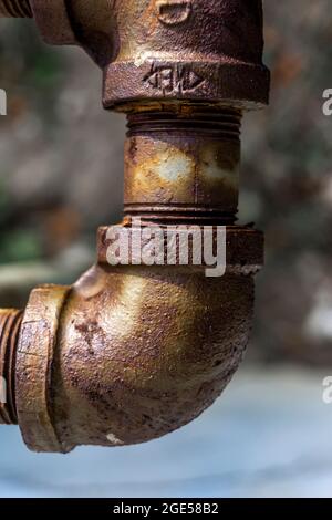 Close view of rusty metal piping elbow connector Stock Photo