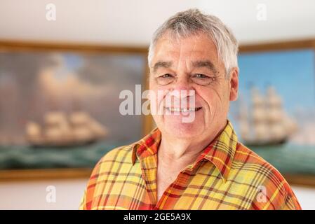 Bochum, Germany. 28th July, 2021. Jürgen Landmann, owner of the Ship in a Bottle Museum, stands in his house in Bochum. Landmann's father opened the museum in 1971. After his death, his son took over the exhibition, which is seen by around 20,000 visitors every year. Landmann is now looking for a successor for his museum in the Hotel Janssen in Neuharlingersiel. (to dpa 'Mini-Welten unter Glas: Buddelschiffmuseum sucht neuer Besitzer') Credit: Caroline Seidel/dpa/Alamy Live News Stock Photo