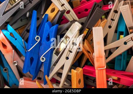 Random clothes hanging pegs in a bucket Stock Photo