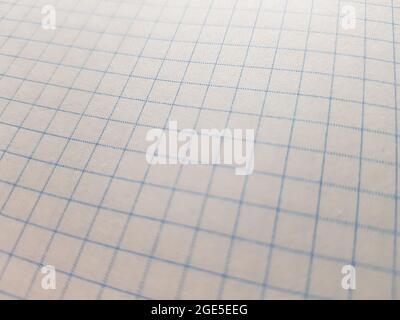 checkered paper sheet background in blue and gray colors. Stock Photo
