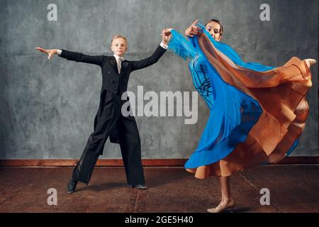 Ballroom dancing. Young couple ballroom dancers. Latin dance and dancer Stock Photo