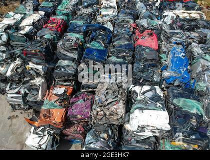 Cars in junkyard, pressed and packed for recycling. Car recycling