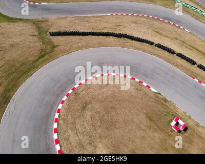 Curves on karting race track, aerial view background. Stock Photo