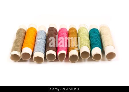 Colorful cotton yarns on rolls for sewing. Thread spools used in fabric and  textile industry Stock Photo - Alamy