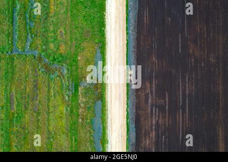 Peat extraction aerial photo, Esterweger Dose in Emsland, drone photo, left renaturalised, middle road, right extraction area, Lower Saxony, Germany Stock Photo