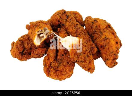 Fried spicy breadcrumb covered chicken fillets isolated on a white background Stock Photo