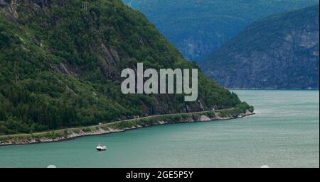 Eidfjord, Norway. Touristic Ship Or Ferry Boat Boat Liner Moored Near Harbour In Summer Day. Aerial View Of Famous Norwegian Landmark And Popular Stock Photo
