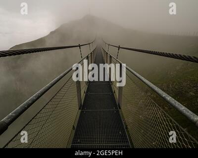 Suspension bridge in the fog, Stubnerkogel, Bad Gastein, Salzburger Land, Austria Stock Photo